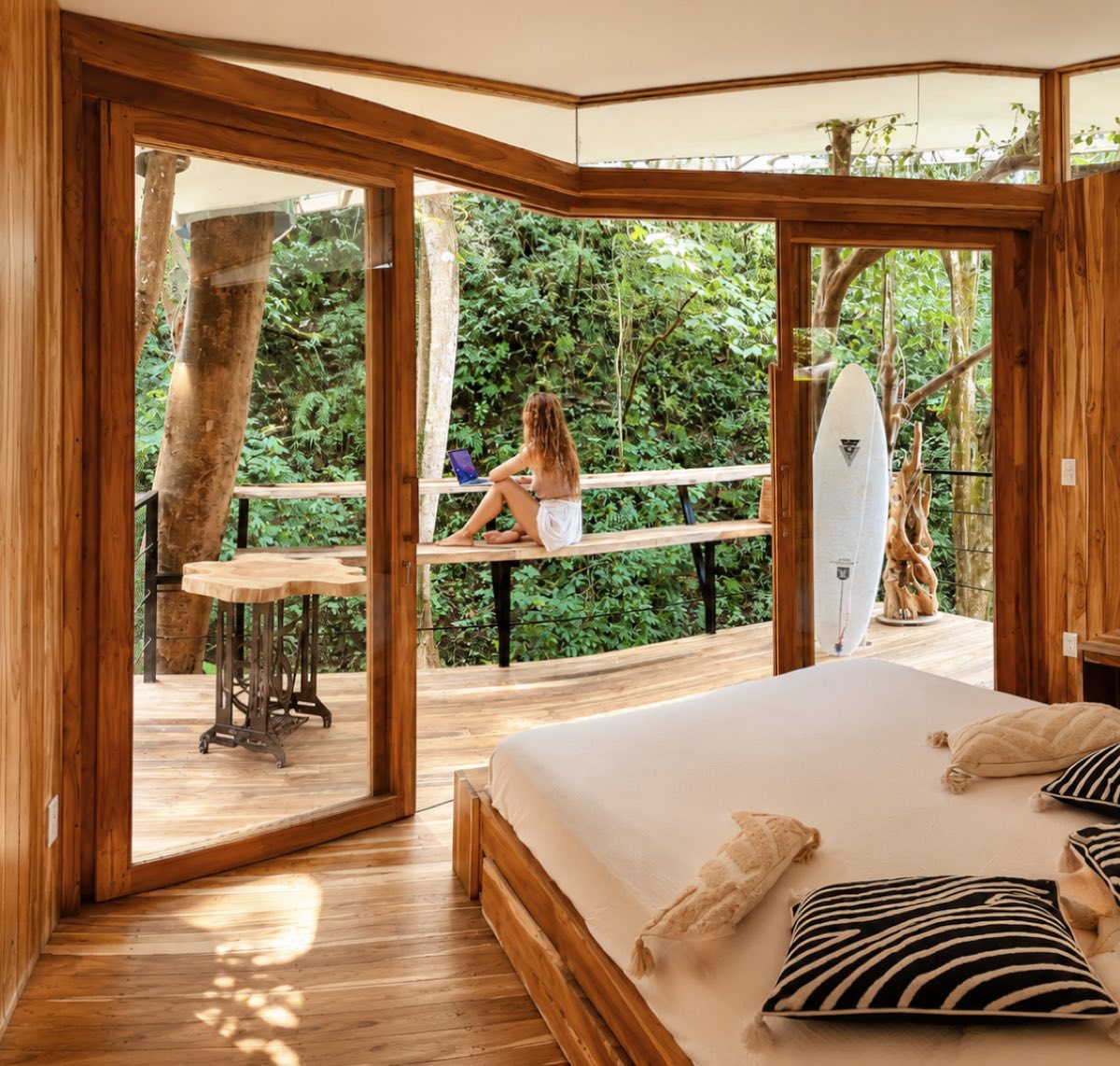 Teak villa opening onto the jungle